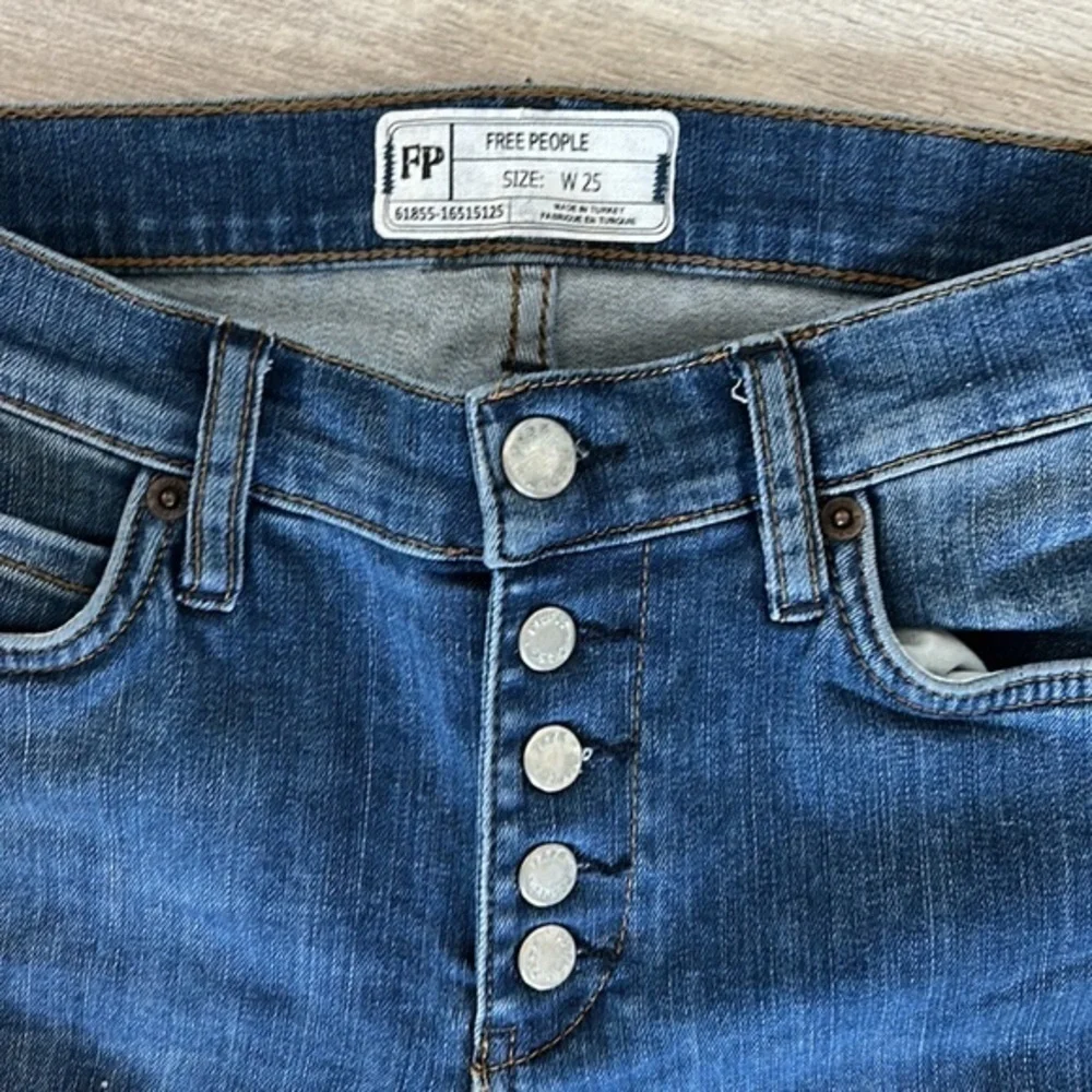 Free People size 25 busted knee button fly jeans